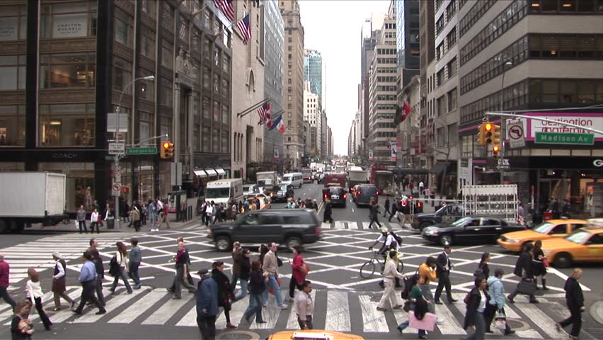 New York, NY - CIRCA March 2006: A busy crosswalk in Manhattan shows off the variety of the types of people you can run into while visiting