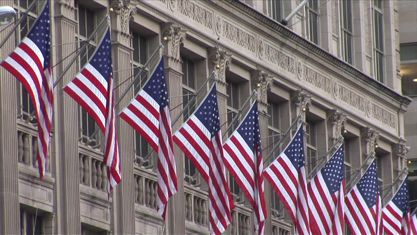 New York, NY - CIRCA March 2006: A row of American flags on the side of a building displays the rampant patriotism that exists in the city.