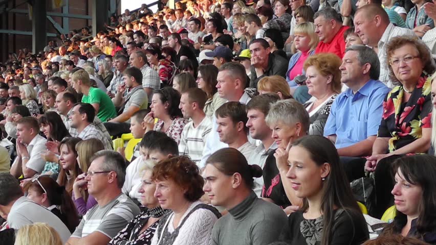 SUMY - JUNE 28: Crowd cheering on the city stadium celebrating the Day of the Constitution of Ukraine on June 28, 2012 in Sumy, Ukraine 