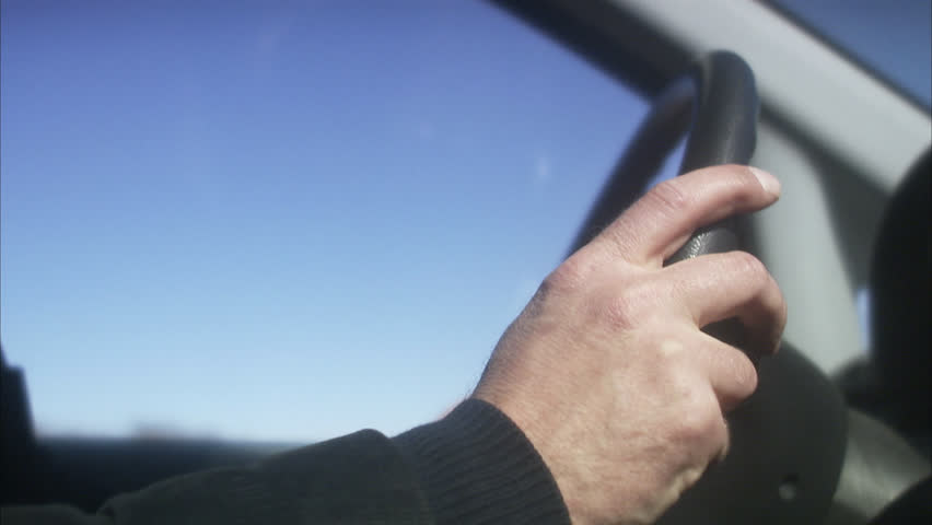 Hands on a steering wheel
