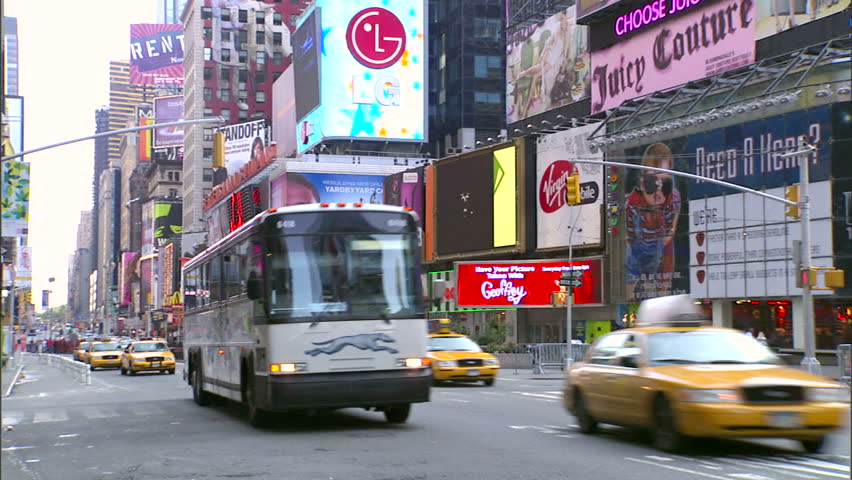 New York, NY - CIRCA 2006: Traffic goes down the street in Times Square during the day, when it is least crowded