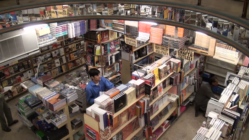 ISLAMABAD - 16 OCTOBER 2010: People are walking around in a book shop in Islamabad, Pakistan
