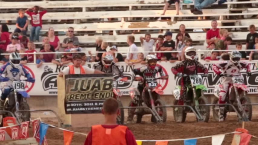NEPHI, JUAB, UTAH JUN 2012: Economic boost to rural community in annual race. Motorcycle enduro race start and route. Juab County extreme enduro. Difficult obstacle course with jumps, logs and rocks.
