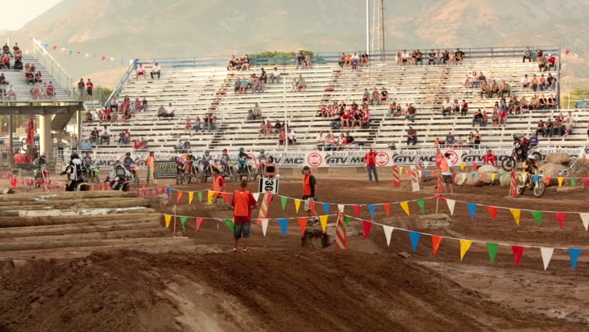 NEPHI, JUAB, UTAH JUN 2012: Economic boost to rural community in annual race. Motorcycle enduro race big jump. Juab County extreme enduro. Difficult obstacle course with jumps, logs and rocks.