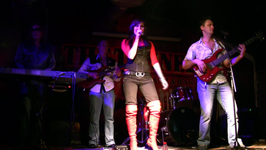 music group in club. Singer, guitar and keyed  