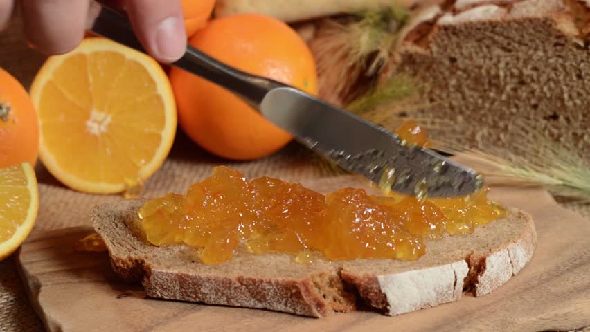 Making an Orange Jam Bread on rustic background