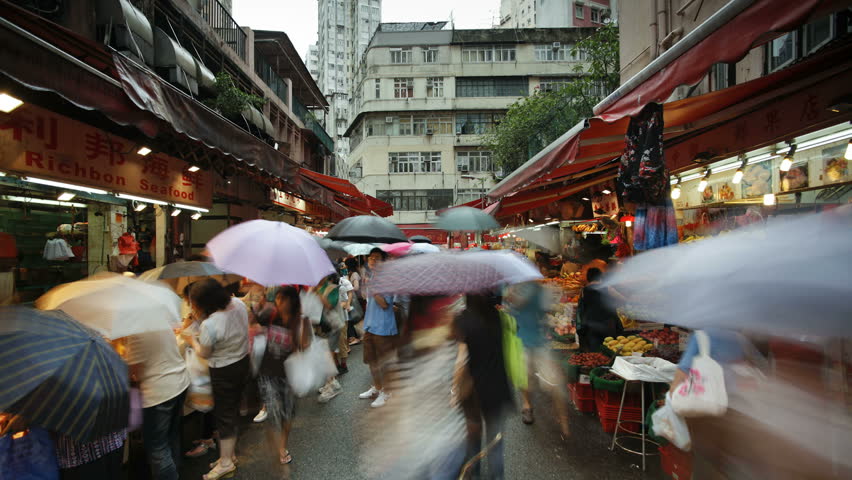 HONG KONG - CIRCA MAY 2011: Shoppers browse the traditional Chinese Stalls in Wanchai market
