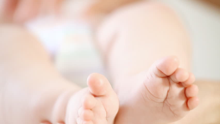 Baby foots on the light background