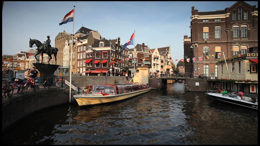 HOLLAND, NETHERLANDS - CIRCA MAY 2011: a shot of a tour boat on Canal, Amsterdam, 