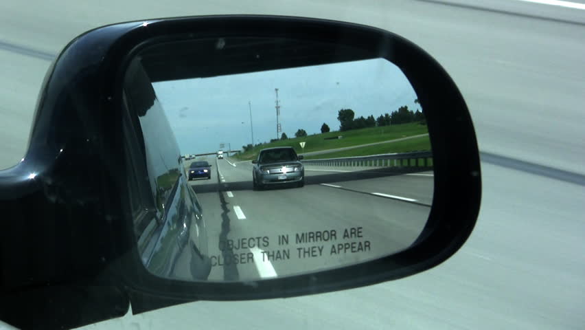 Objects In Mirror May Be Closer Than They Appear. Driving down Interstate 70 in Kansas.