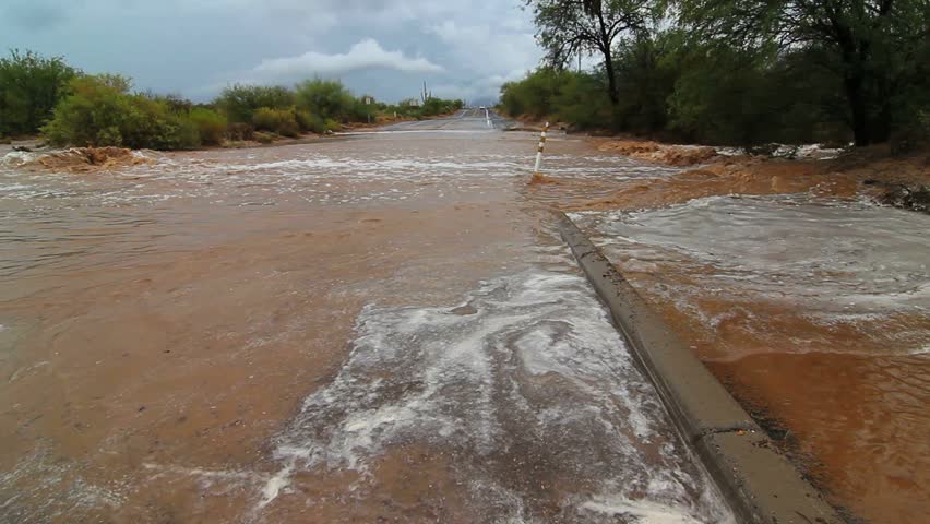 Flash floods inundate city streets, curbs underwater, after heavy summer rains.  1080p