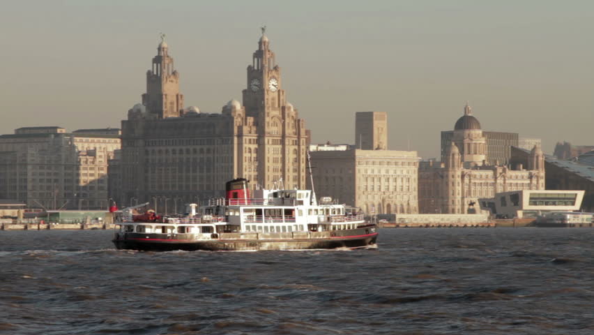 LIVERPOOL, MERSEYSIDE/ENGLAND - JANUARY 16: The Mersey ferry sails past the UNESCO Liverpool skyline on January 16, 2012 in Liverpool. The ferry plies between Liverpool and The Wirral. 
