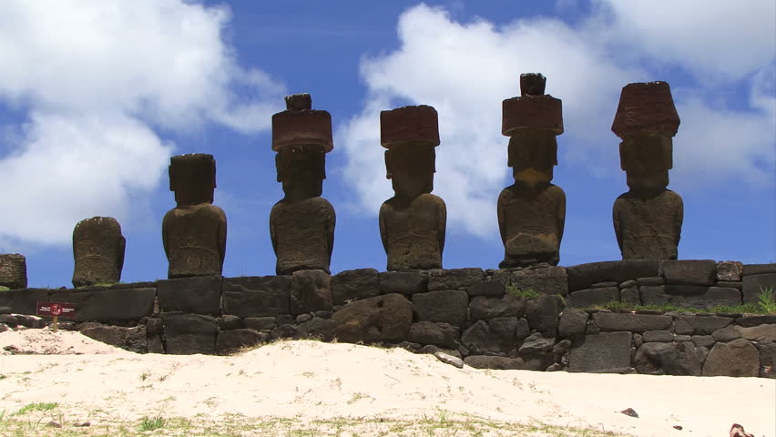 Moai in a line on a beach at Easter Island