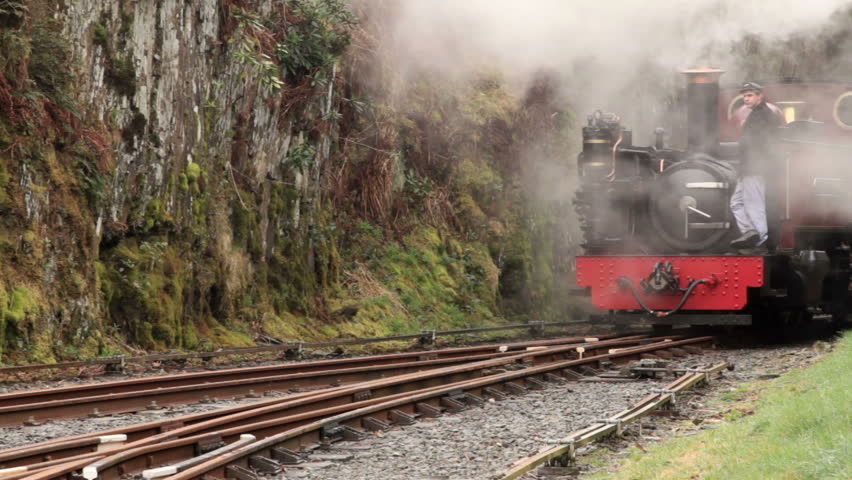 DEVILS BRIDGE, CEREDIGION/WALES - APRIL 7: Unidentified driver takes the steam engine to the front of the train on April 7, 2012 in Devil's Bridge. The steam train takes tourists to Aberystwyth.