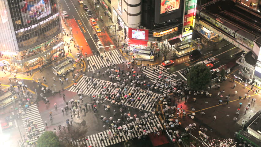 TOKYO, JAPAN - CIRCA MAY 2011: Tokyo centre with the busiest pedestrian crossing in the World in the rain
