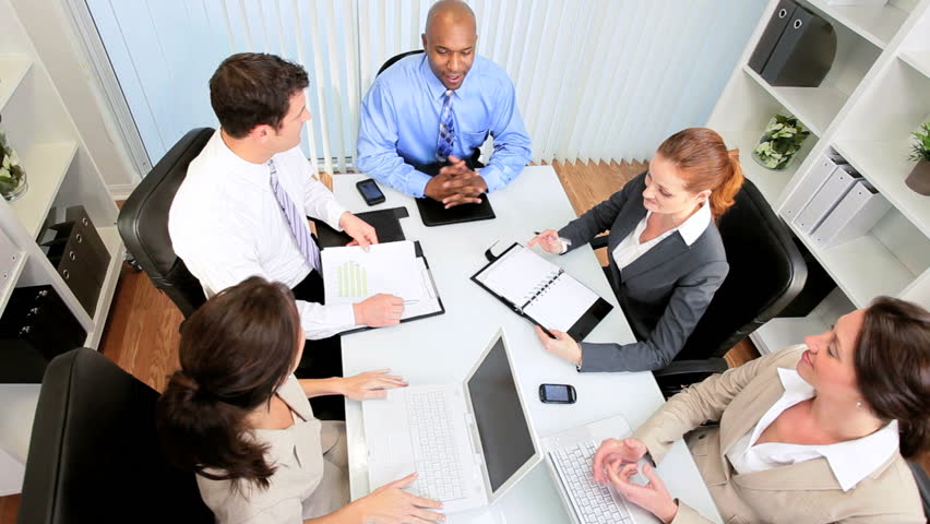 Boardroom meeting young multi ethnic business executives