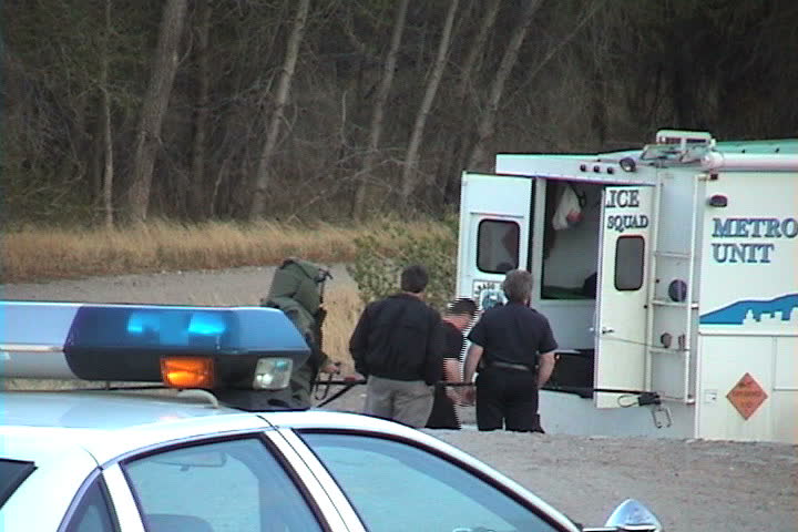 Salida, CO - May 2002: Denver bomb squad dismantles explosive device.