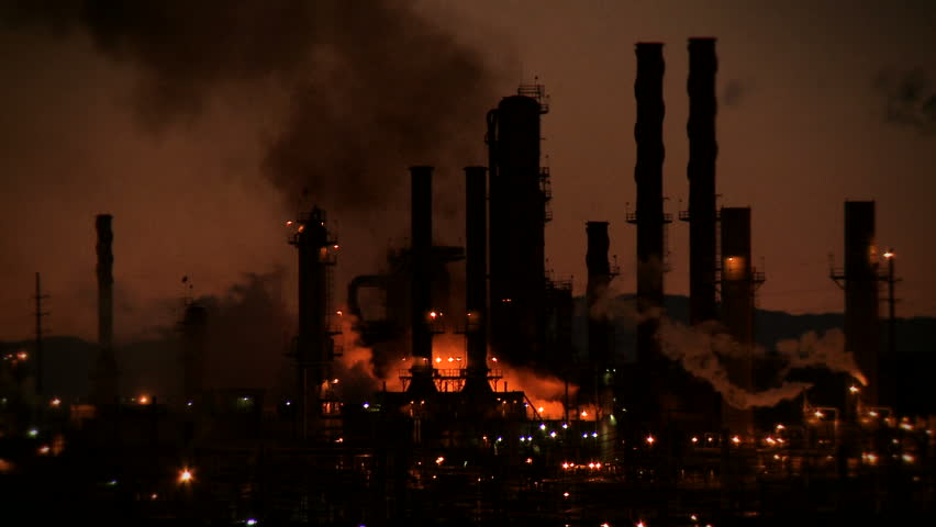A fire burns against the night sky at an oil refinery in Richmond, California.