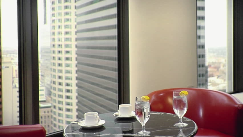 CU, Lockdown, Two businessmen meeting, exchanging business cards and sitting down at a hotel dining