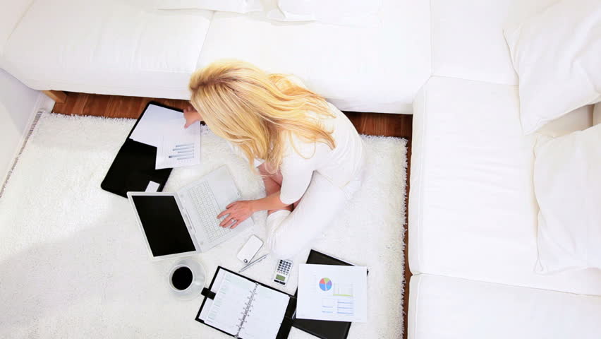 Blonde freelance business advisor working home against the clock contract deadline