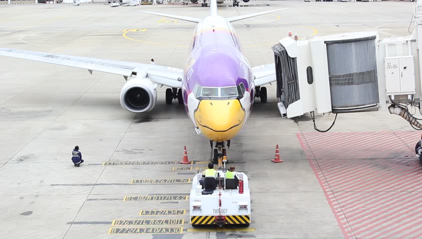 BANGKOK - CIRCA AUGUST 2012: A plane from the airline Nok Air on the tarmac at Suvarnabhuni International airport circa August 2012 in Bangkok, Thailand.