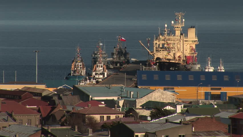 Boats docked at a seaport in Punta Arenas, Chile