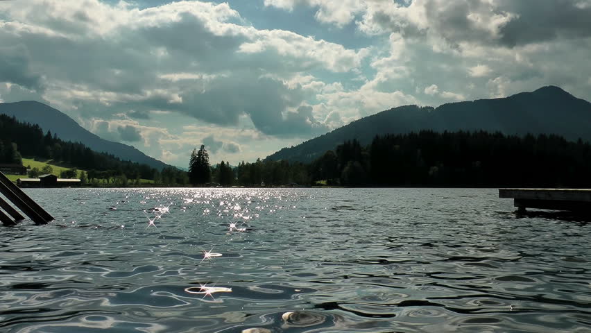 The Austrian Alps in the distance and the Schwarzsee lake of Kitzbuhel glistening below.