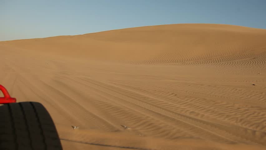 video footage of driving with a buggy off-road in the dunes of Ica, Peru