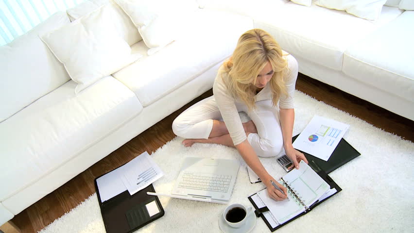 Blonde freelance business advisor working home against the clock contract deadline