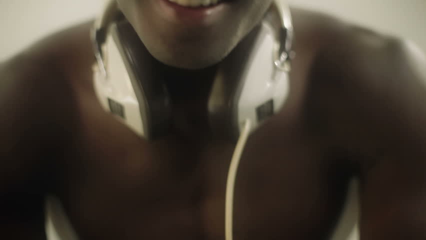 young african guy waving and dancing with a cool attitude with a smile