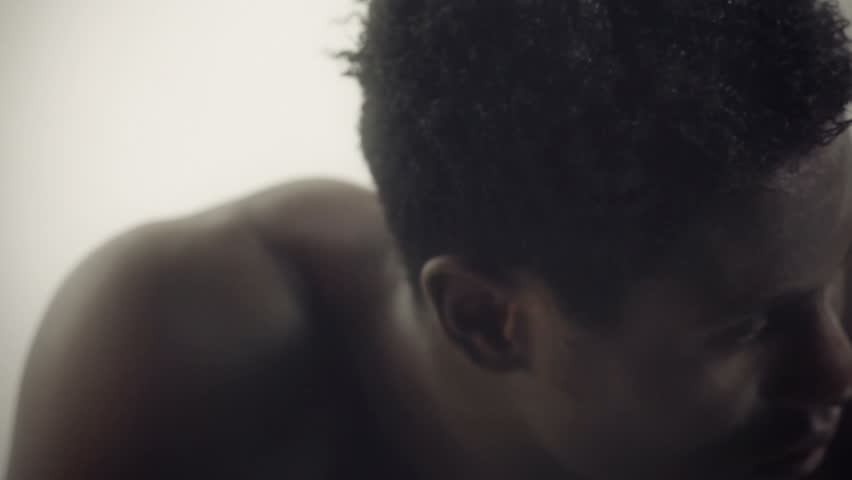 young african guy waving and dancing with a cool attitude and looking around