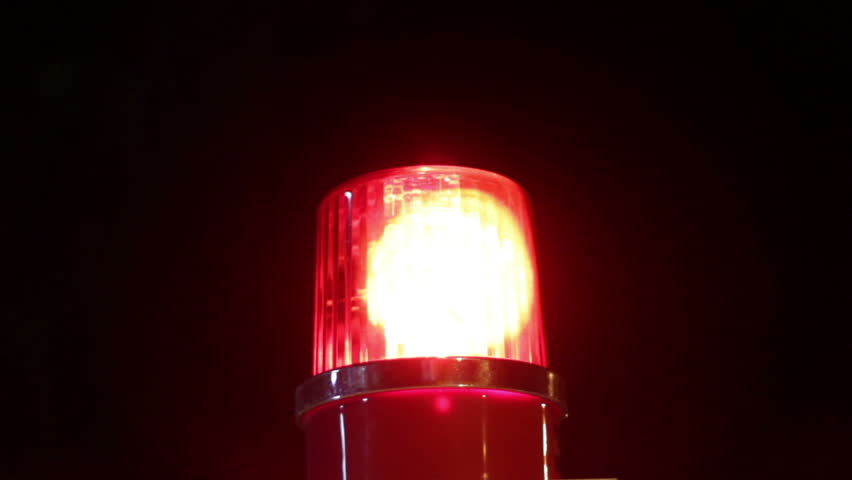 hd video of red alarm light at night/emergency light/red alarm light rolling on dark background
