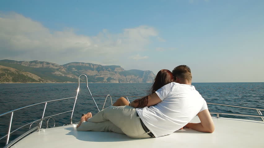 Couple Relaxing on a Speedboat