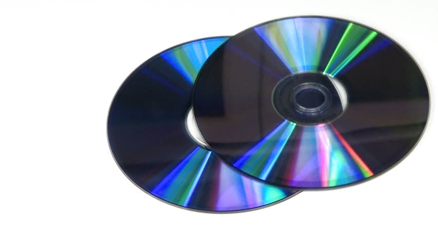 Computer CD DVD rotating on white background