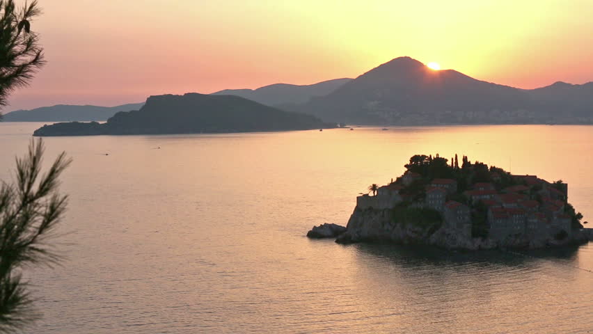 Pink sunset and Sveti Stefan sea islet view from up (Montenegro, 6 kilometers southeast of Budva)
