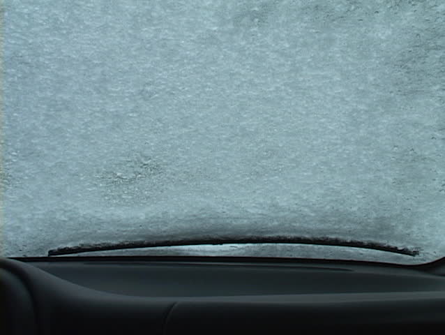 windshield is cleared of snow and ice