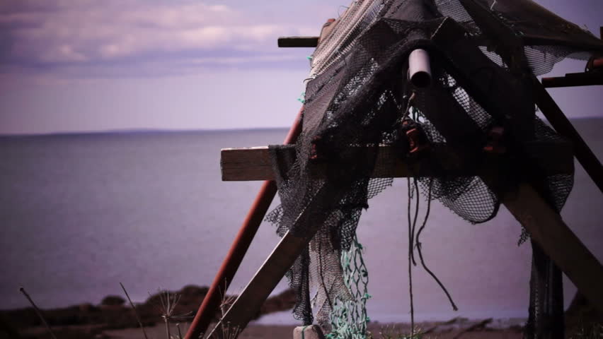 Old fishing nets blowing in the wind. Old and rusted machinery. HD 1080p. Beech in Reykjavik Iceland.