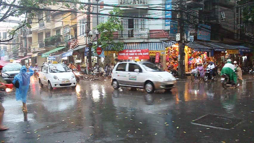 HANOI - AUGUST 9: Street during a monsoon rain on August 9, 2012 in Hanoi, Vietnam
