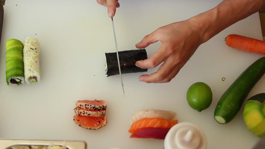 Chef preparing sushi roll