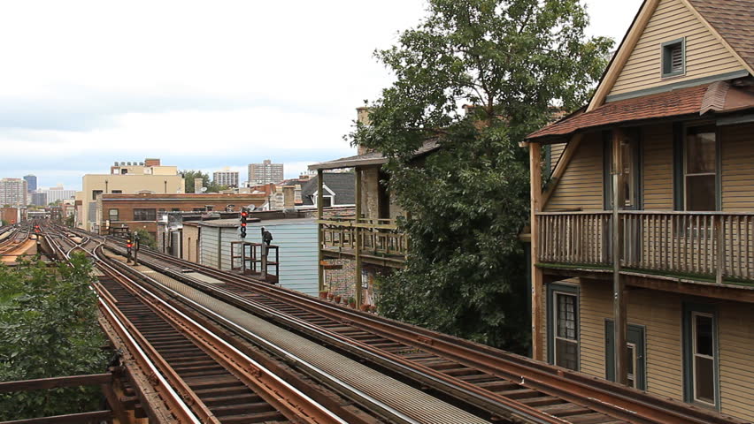 Chicago L Train. Chicago elevated rail passing closely to apartments near the Addison station.