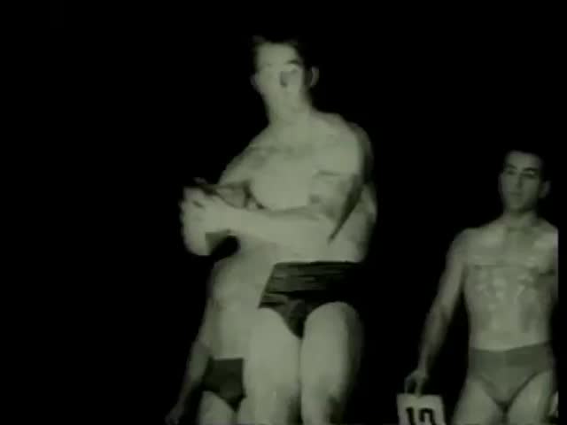 Competitor displays his muscles at the men's competition for the title of Apollo in Paris circa 1958-MGM PICTURES, UNIVERSAL-INTERNATIONAL NEWSREEL, USA, filmed in 1958