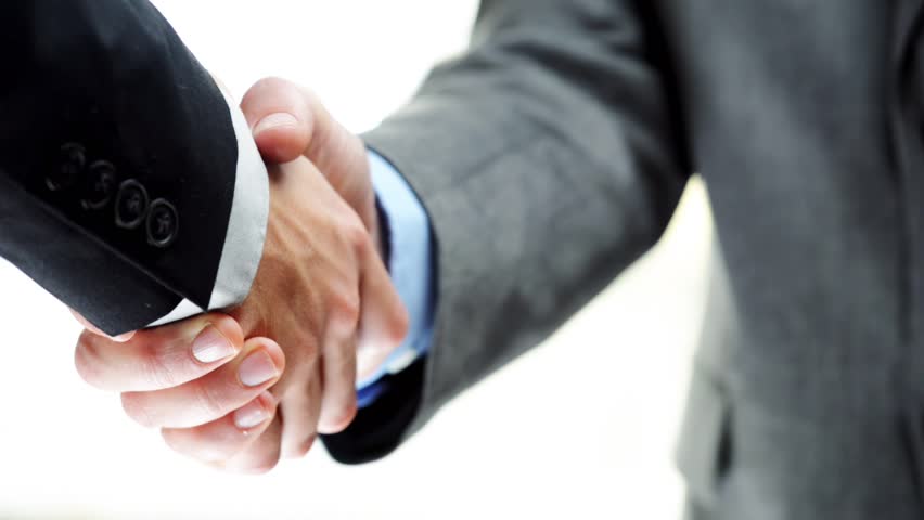 Businessmen shaking hands business deal partnership high definition