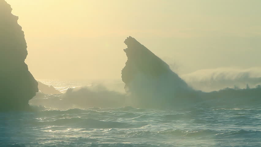 Stormy waves and sky beside the cliff 
