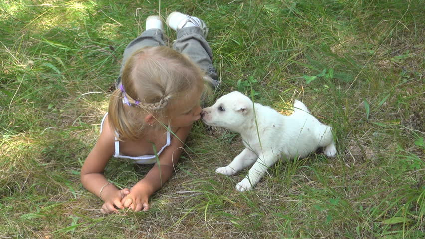 Child Kissing her Puppy, Child Playing with her Little Dog
