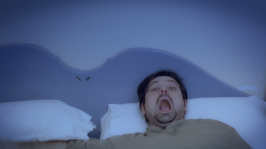 A sleeping man's reaction to something scary or annoying. See my other "
Ghost-themed clips for a complementary clip to add to this one. Suitable for horror, Halloween or Christmas scenes.