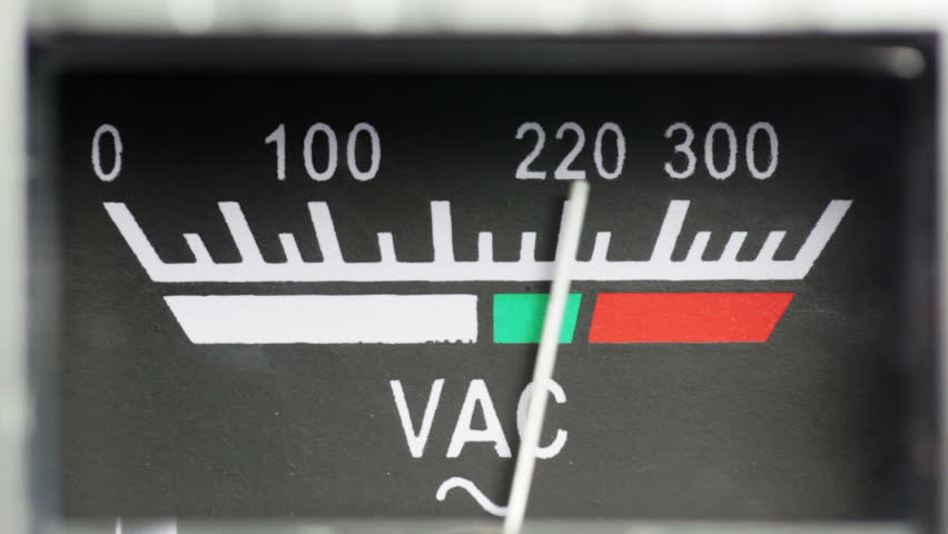 Voltmeter. Vintage analog volt meter close up.
