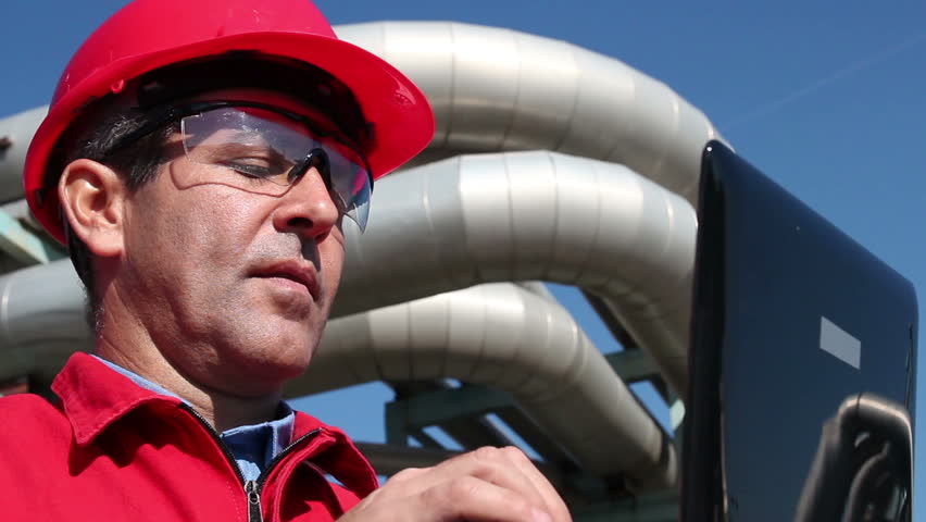 Engineer Inside Oil and Gas Refinery Using Laptop.New age engineer.HD1080p.