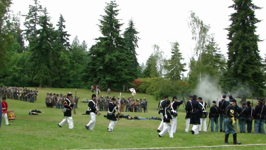 PORT GAMBLE, WA - JUN 20 -	Confederate and Union infantry trade volleys, and a drummer boy is wounded 		in a mock battle at Port Gamble WA on Jun 20, 2009.
