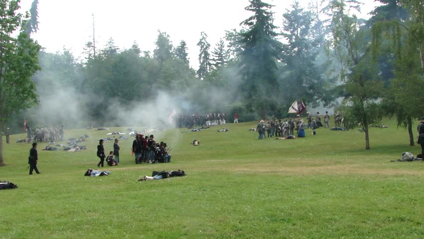 PORT GAMBLE, WA - JUN 20 - 	Union infantry kneels and fires a volley		in a mock battle at Port Gamble WA on Jun 20, 2009.
