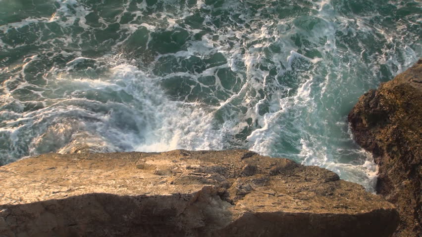 Waves on Cliffs in Sunrise